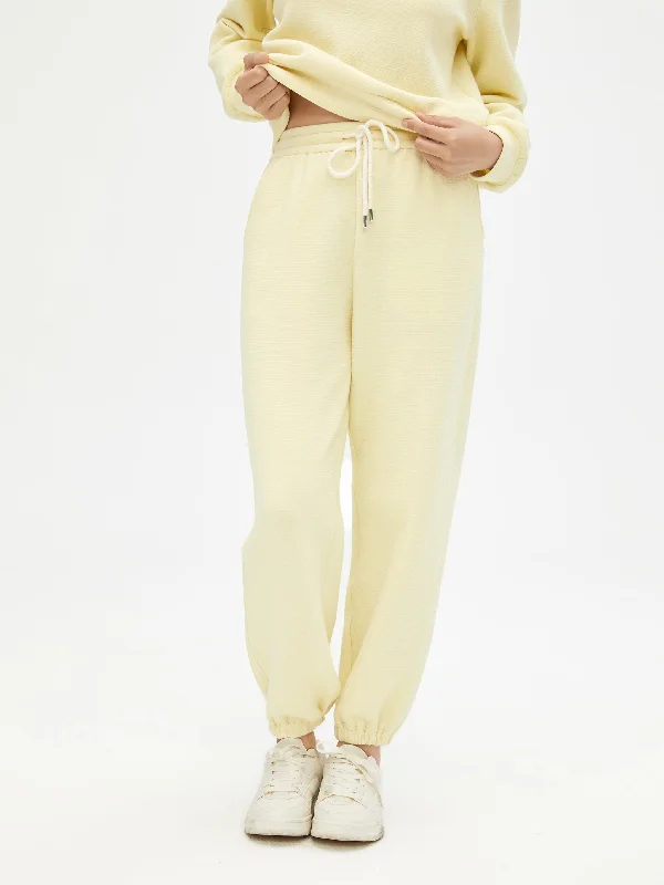 Create a timeless wardrobe with fashionable pieces   Cheese Yellow Suit Sweatpants